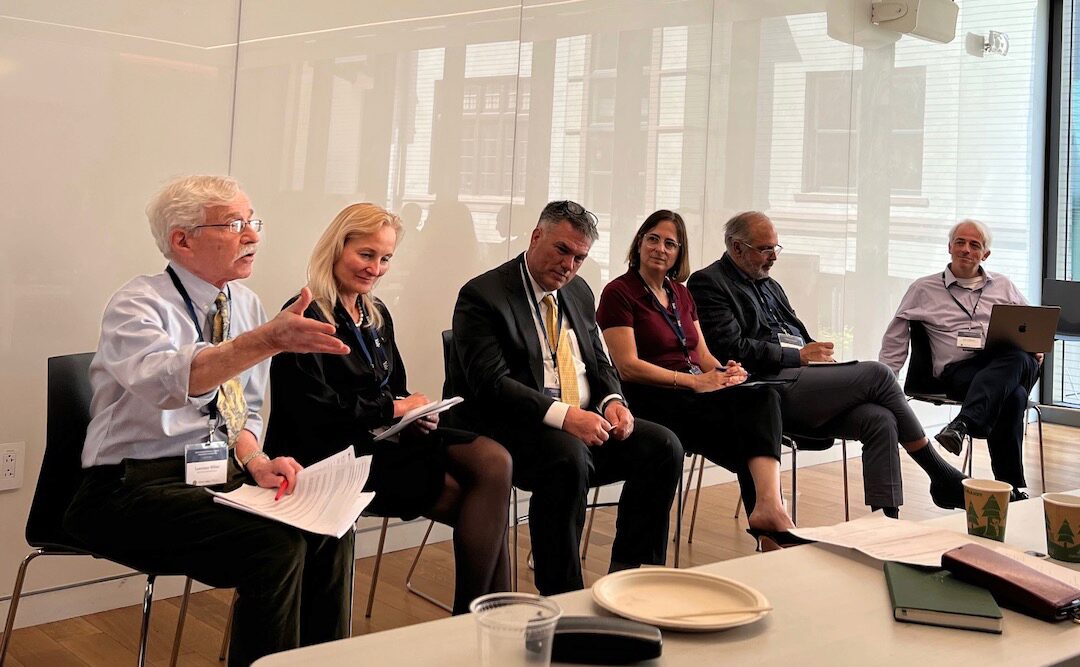The Rethinking Optimal Deposit Insurance panel in conversation in a classroom.
