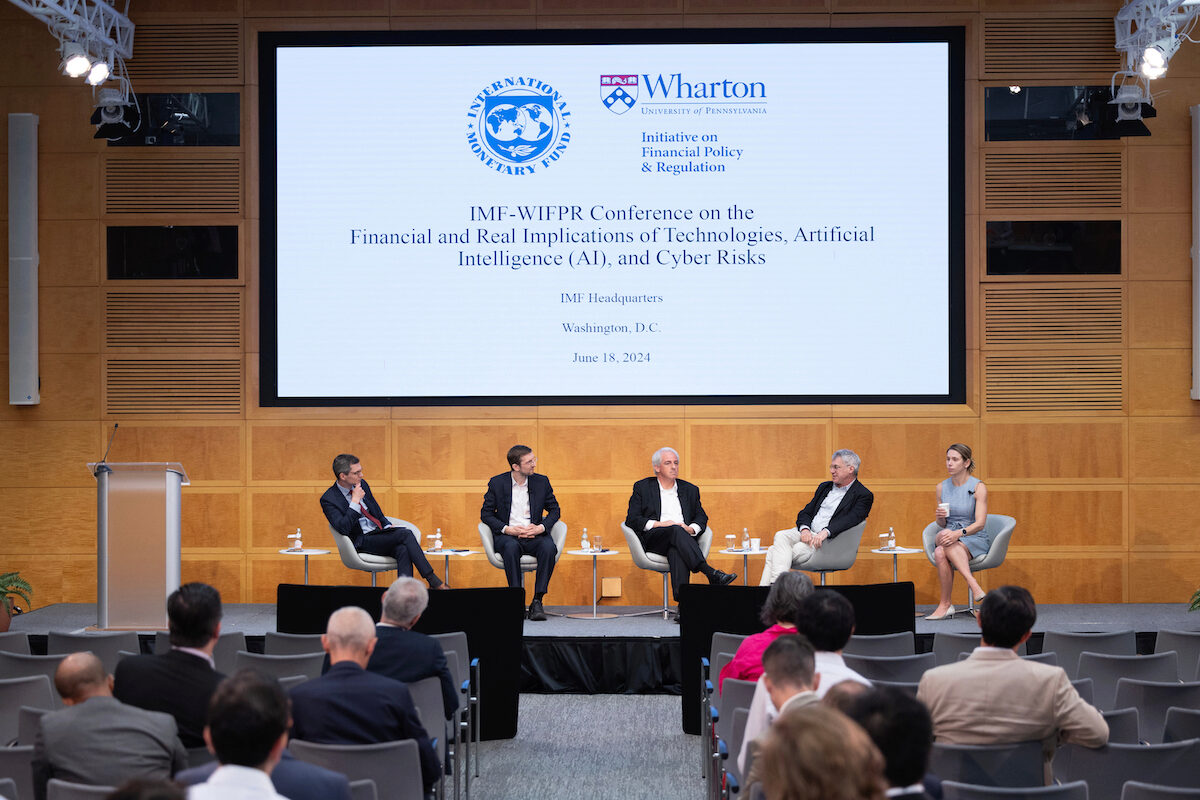 Headline panel on research, “New Technologies and Artificial Intelligence: Landscape, Challenges, and Outlook,” sits on a stage.